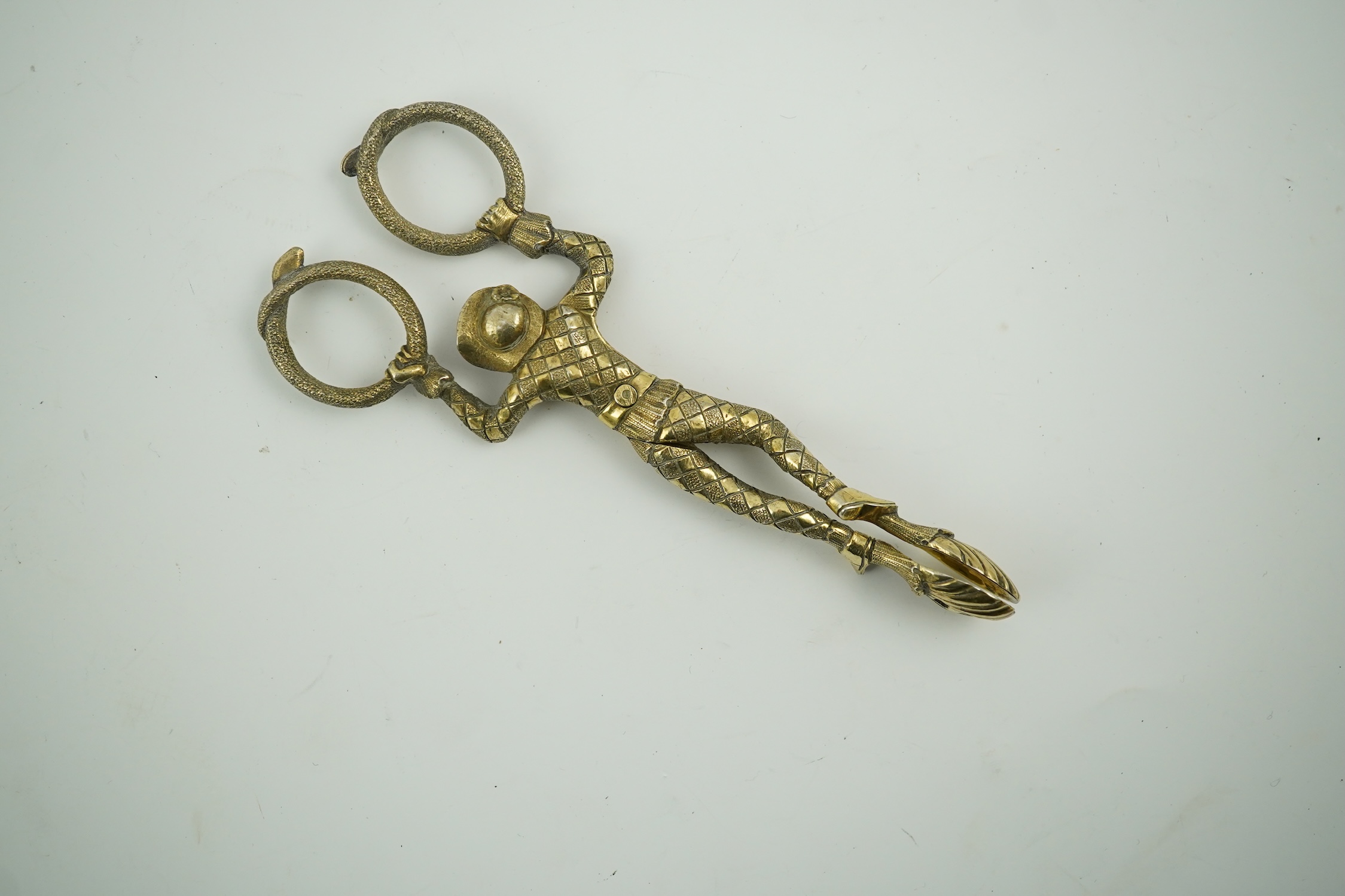 A pair Victorian of silver gilt harlequin sugar tongs, by Lias & Lias, London, 1867, 12.1cm. Condition - fair to good